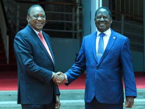 Kenya's President Uhuru Kenyatta (right) and opposition leader Raila Odinga shake hands after meeting at Harambee House, Nairobi on March 9, 2018. PHOTO | JEFF ANGOTE | NMG